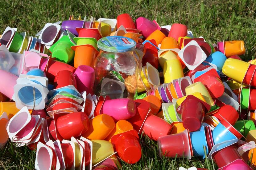 Empty reusable plastic cups laid out in a pile