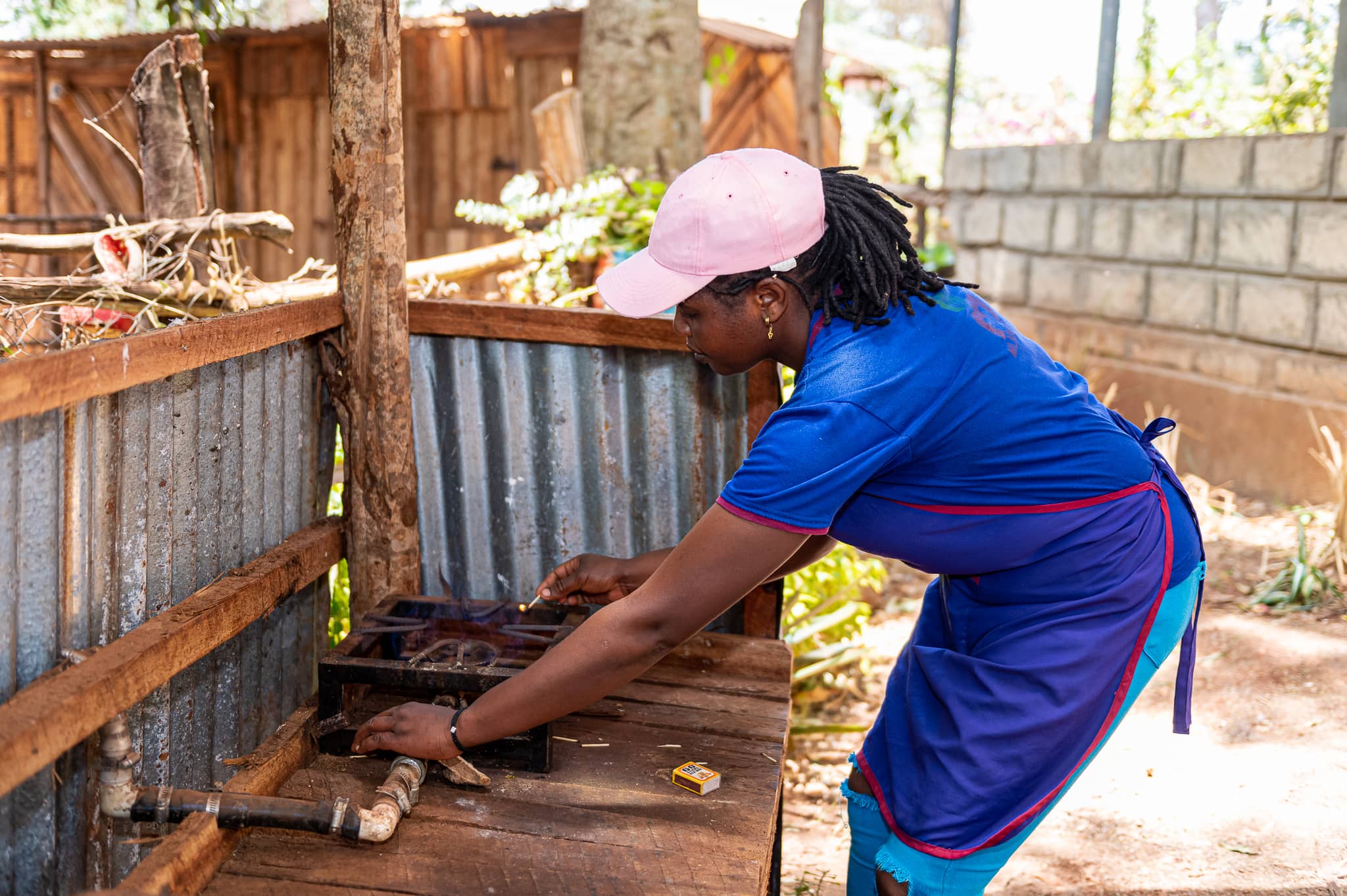 a person working Mlango farm's bio-digester