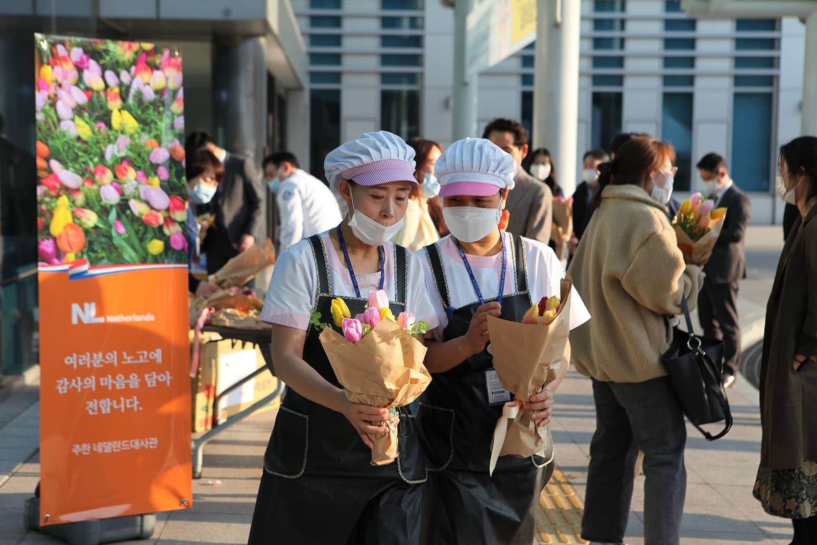 Hospital staffs with tulip bouquets