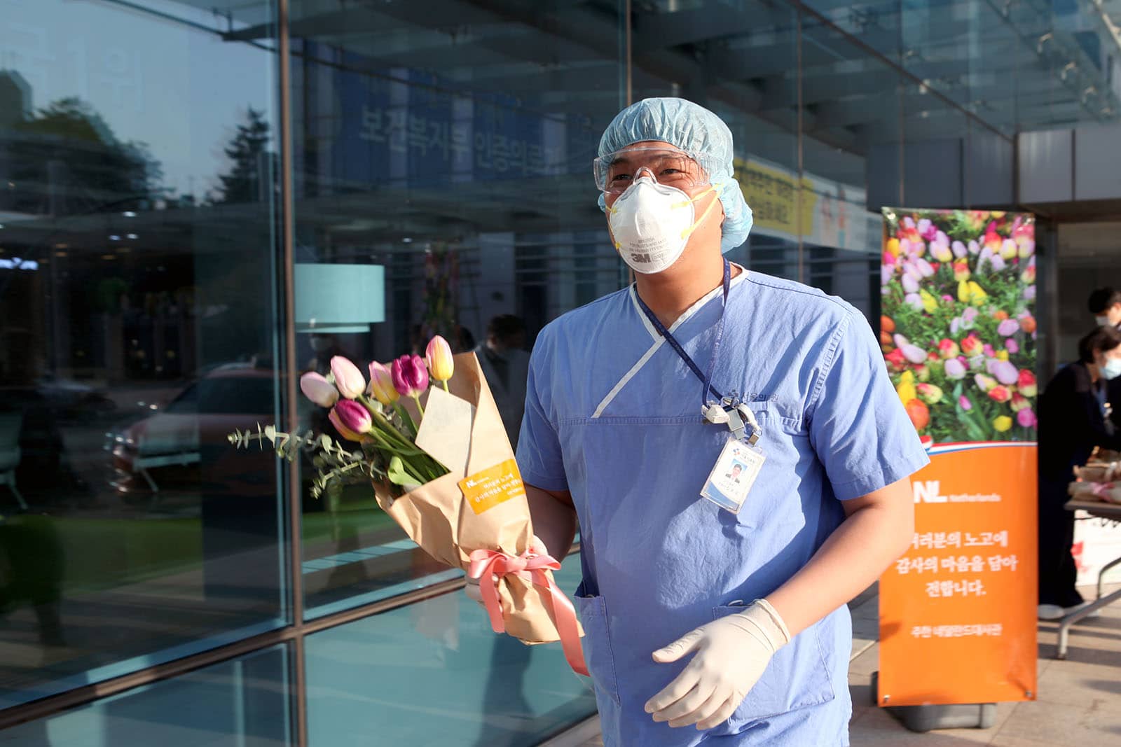 Medical staff with tulip bouquet