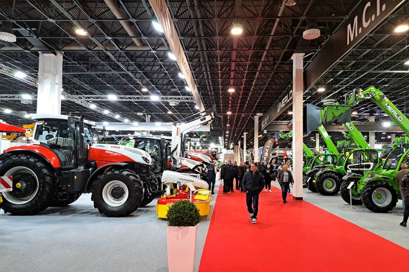 Tractors, harvesters, and other agricultural machines can been in an exhibition hall
