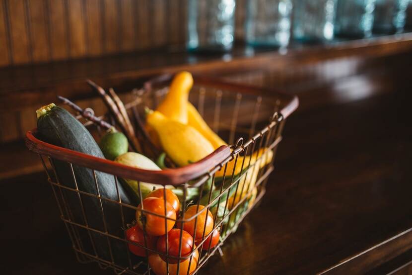 A shopping basket with vegetables