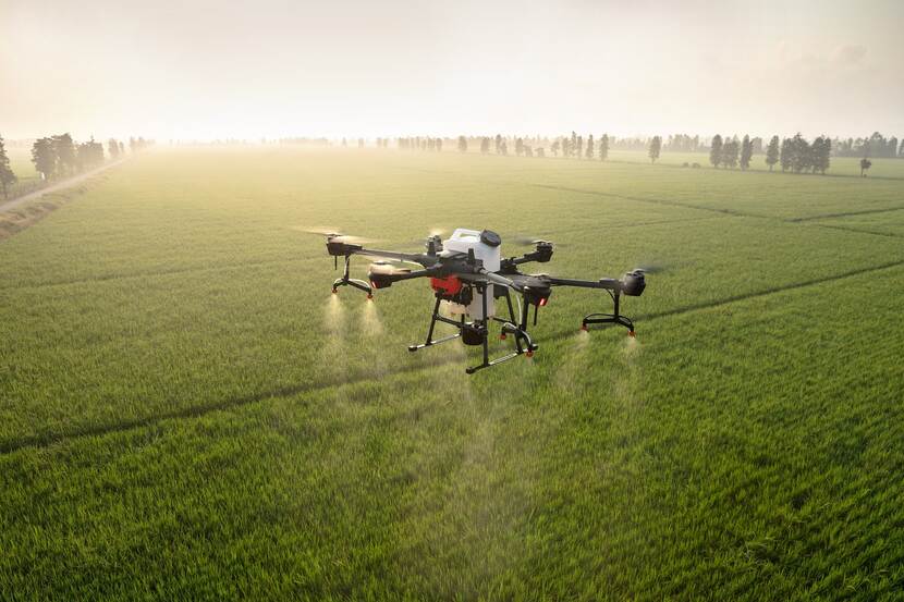 An agriculture drone flying over a field.