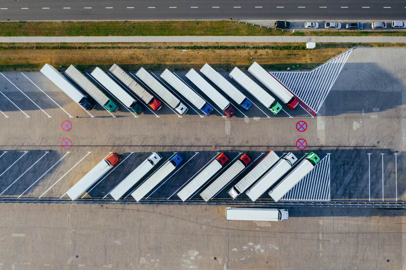 Aerial view of trucks parked in a parking lot.
