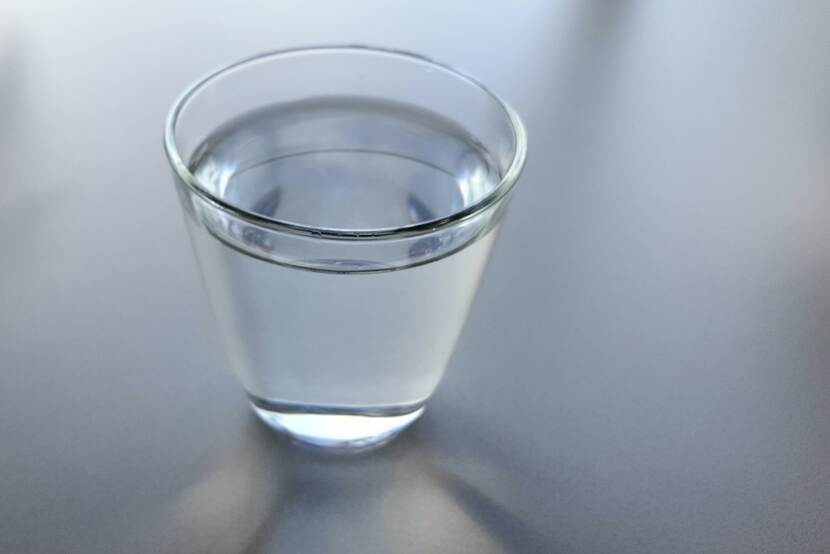 glas of water on a grey background