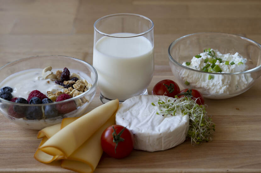 wooden plate with dairy products