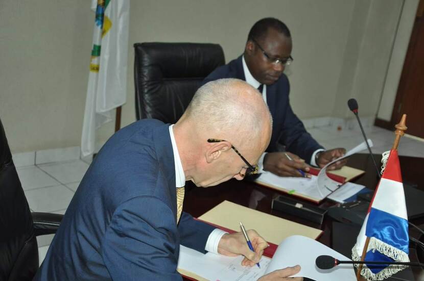 Ambassador signing the agreements