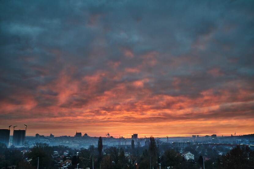 Evening in Belgrade, with a crimson hue reflected on the clouds above the city.