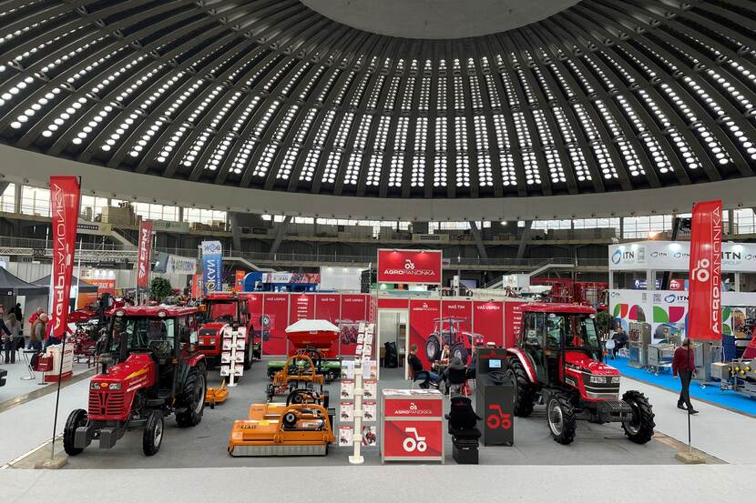 Tractors and other agricultural machines in an exhibition hall