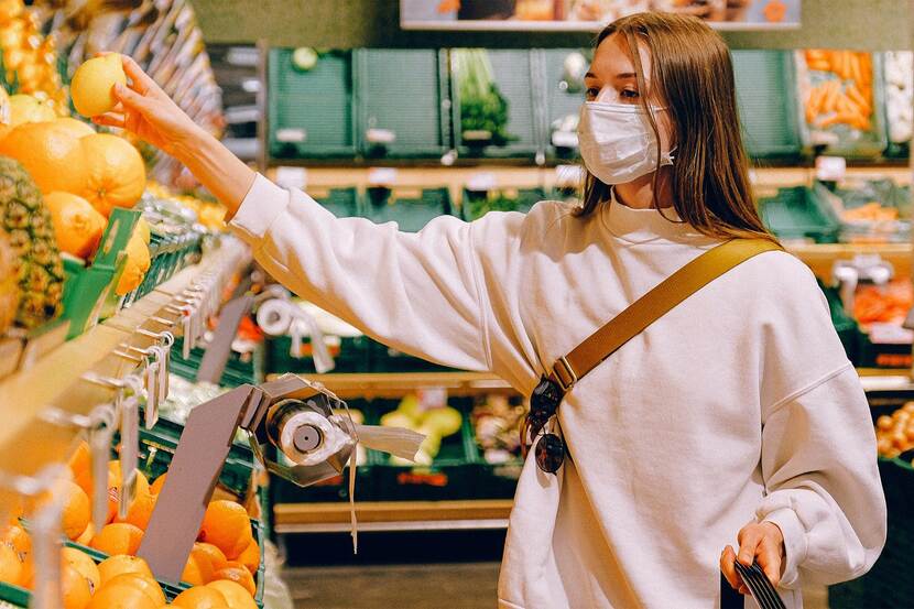 A woman shopping in a grocery store.